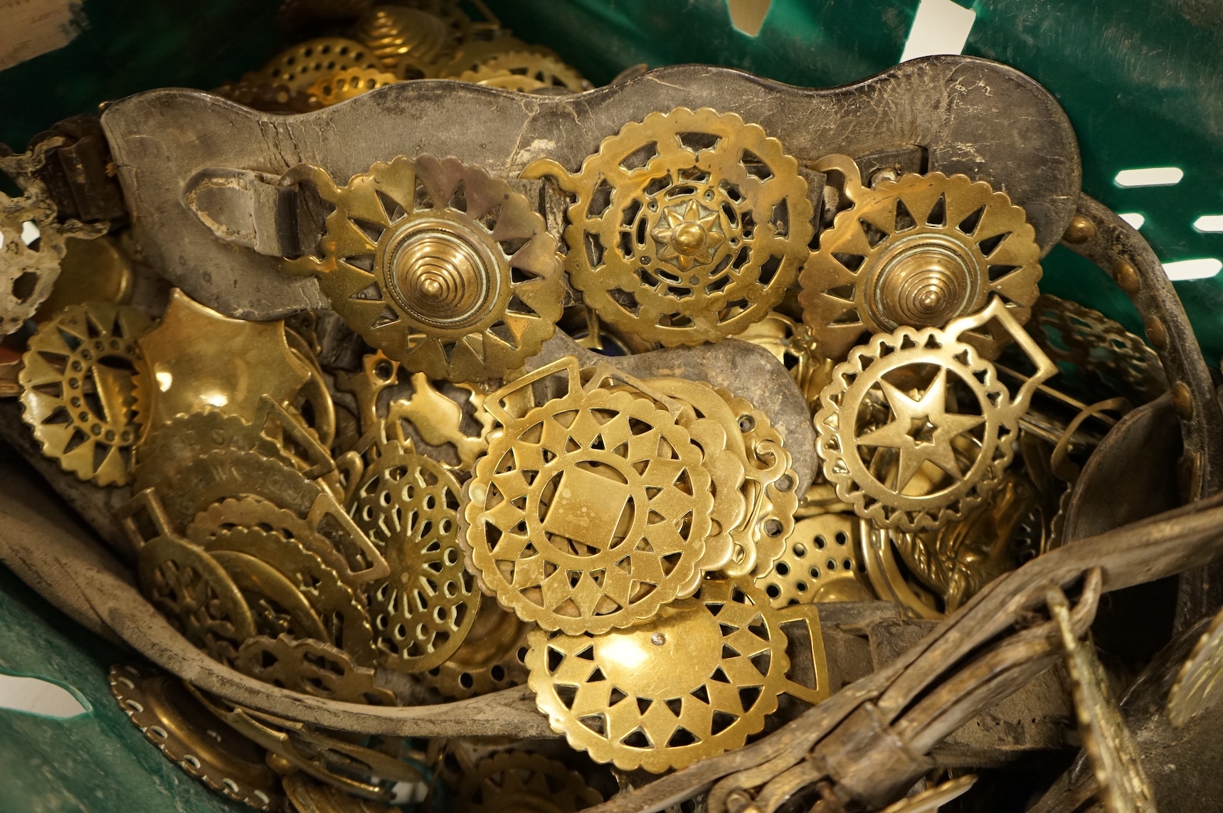 A collection of various horse brasses